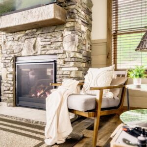 Closeup of chair next to fireplace