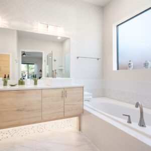 Clean bathroom with tub and vanity